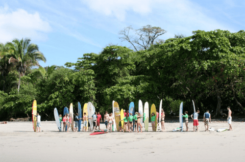 Campers learning to surf in Santa Teresa